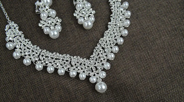 White pearl bridal jewellery set with necklace earrings and hair accessory with diamond accents style 0284