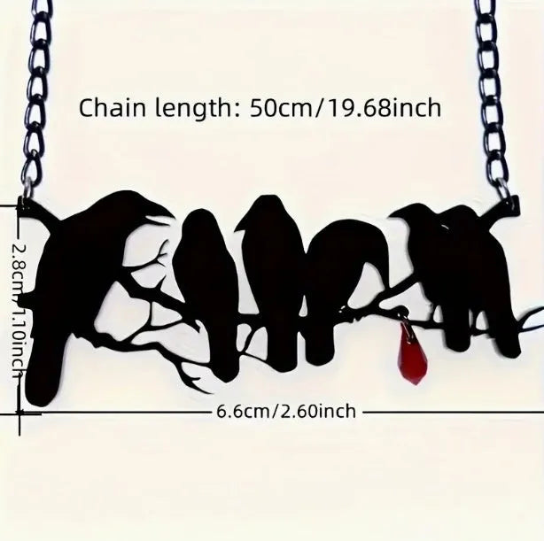 Black alloy crow pendant necklace with electroplated finish and cross chain, gothic bird jewellery.