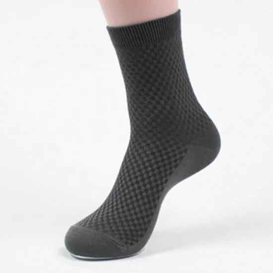 Men's bamboo fibre socks in a small square pattern, shown in neutral colours including grey and navy.