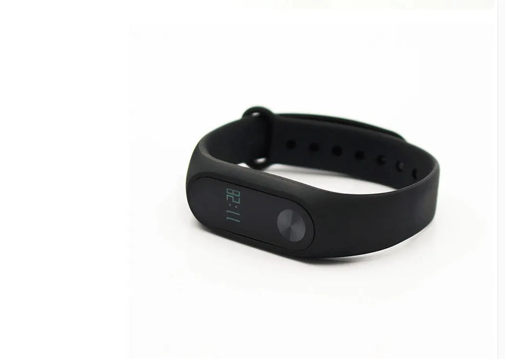 Black Xiaomi Mi Band 2 smartband with OLED screen on an adjustable thermoplastic wrist strap.