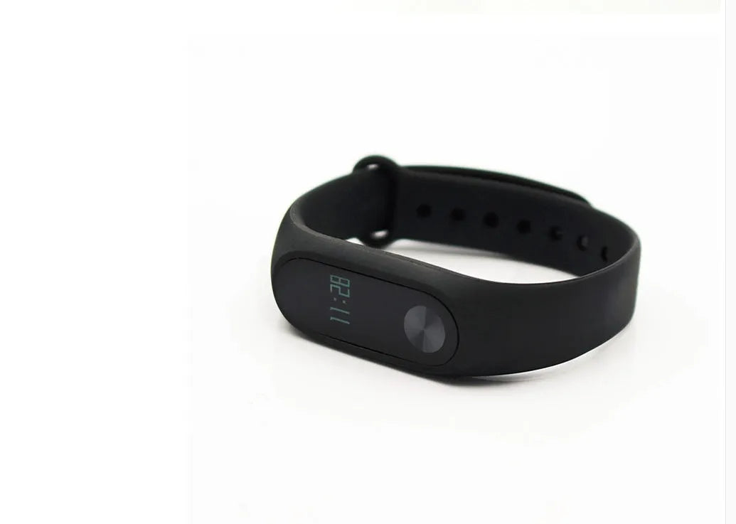 Black Xiaomi Mi Band 2 smartband with OLED screen on an adjustable thermoplastic wrist strap.