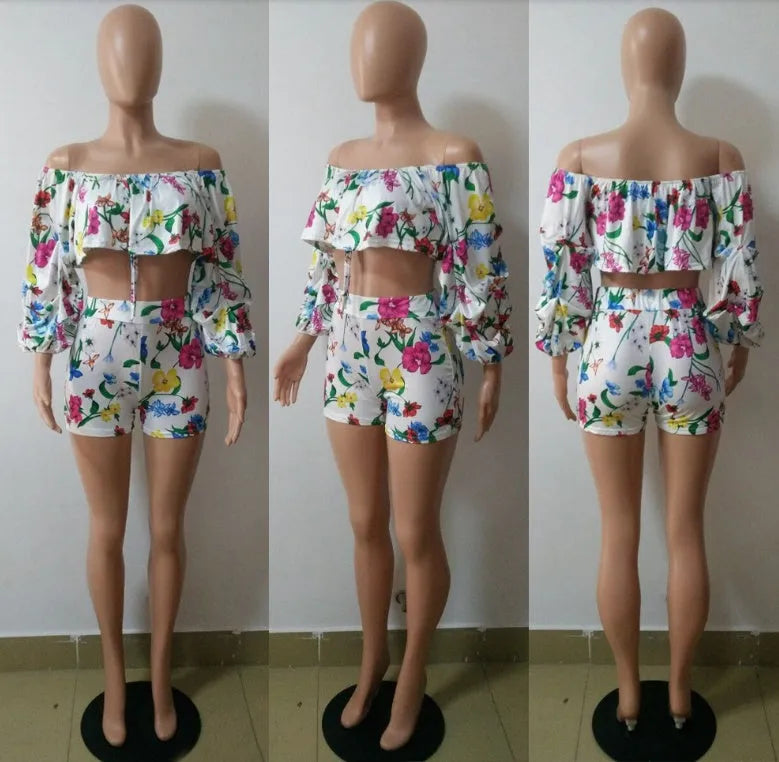 Women's two-piece set with multicolour digital print, pile sleeves on crop top, and matching shorts.