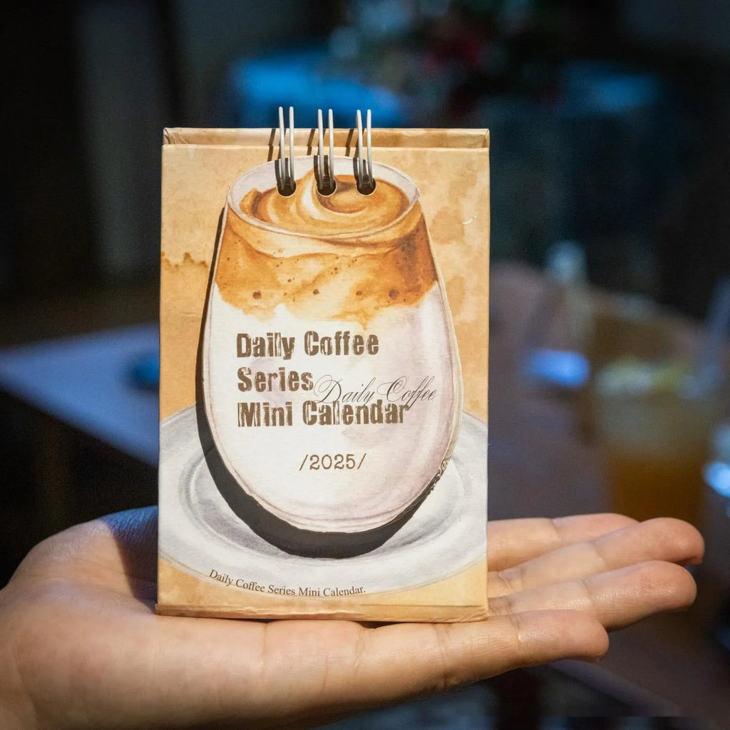 Coffee-themed mini desk calendar for 2025 with motivational designs for compact organisation