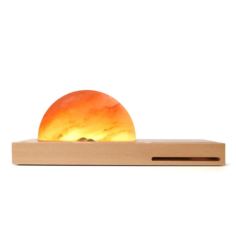 Sunrise Oriental wooden base table lamp with natural crystal salt shade and wireless phone charging pad.