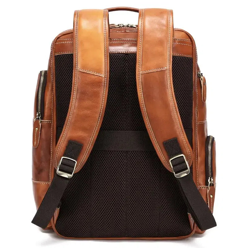Bronze real leather zipper backpack with laptop compartment up to 15 inches, top handle and adjustable shoulder straps.