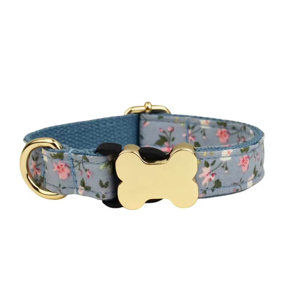 Flat nylon dog collar with a printed grid pattern and a white bone-shaped plastic buckle.