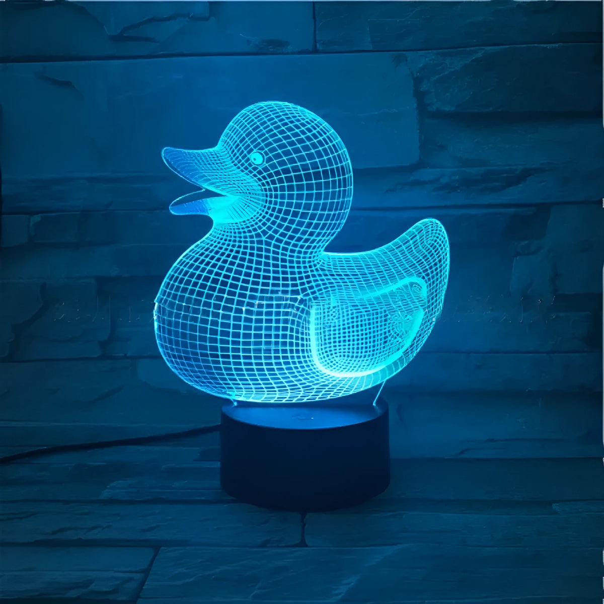 Little Yellow Duck 3D LED night light showing acrylic duck shape on ABS base, with remote control.
