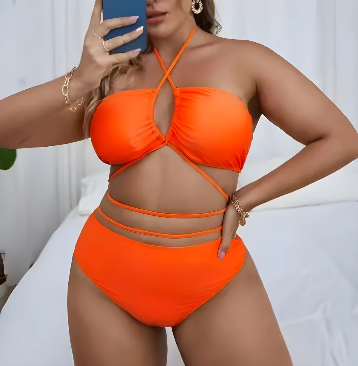 Plus size split bikini set in solid black or orange with sleeveless top and briefs, sizes L to 4XL