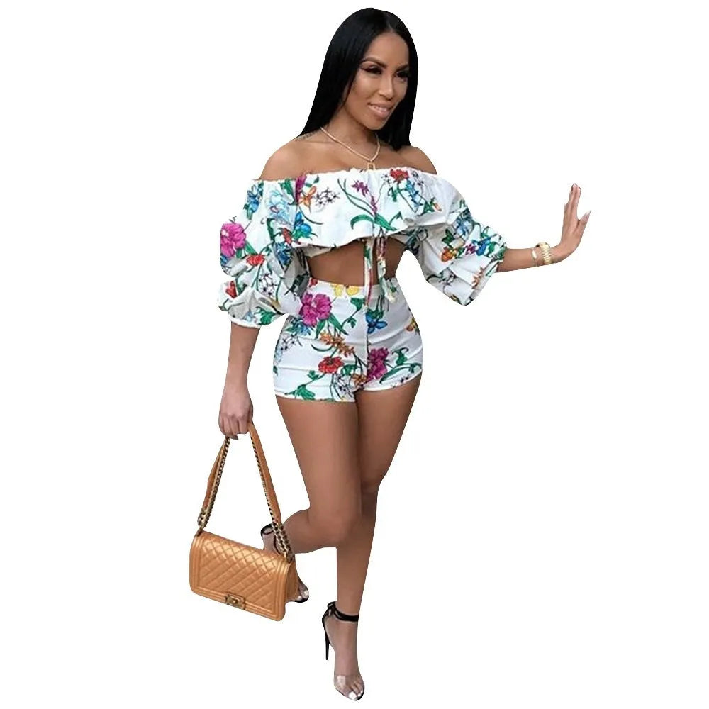 Women's two-piece set with multicolour digital print, pile sleeves on crop top, and matching shorts.