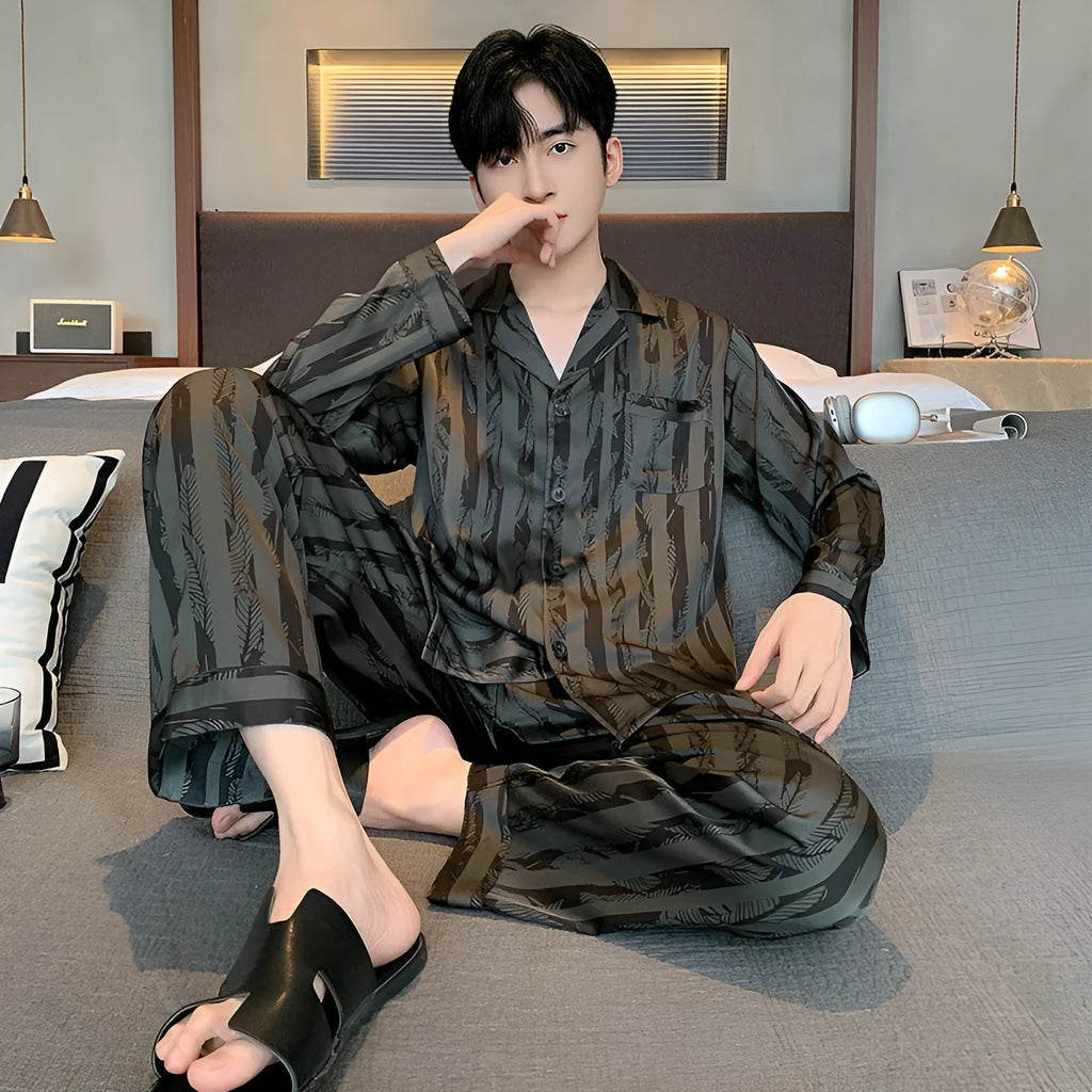 Men's black striped ice silk V-neck pyjama set with long sleeves and trousers.