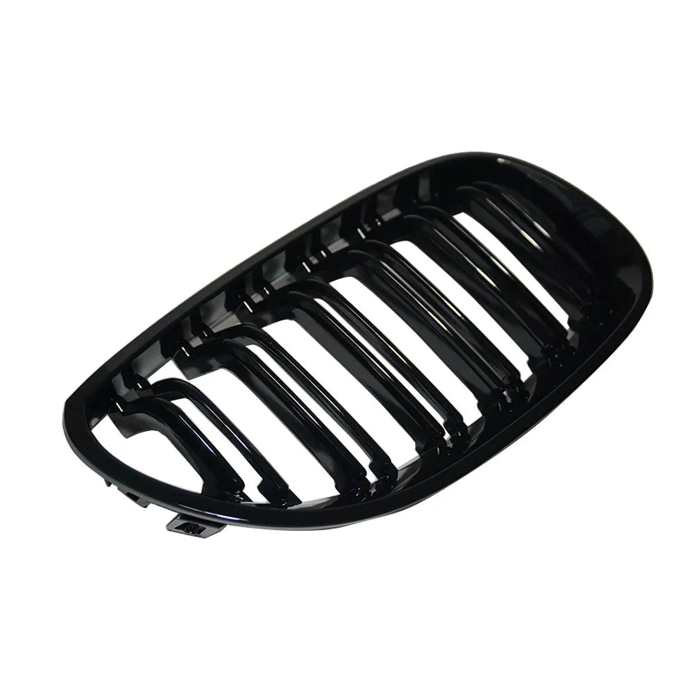 Pair of ABS carbon fibre pattern grilles for a BMW 5-Series front bumper.
