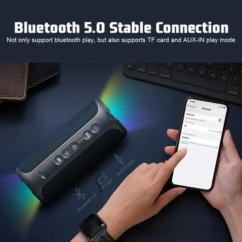 Black and blue fabric wireless Bluetooth speaker with multi-colour lighting and waterproof outdoor design