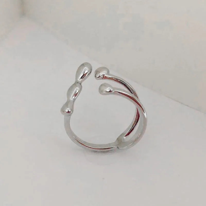 Brass opening ring with spherical design in gold or silver colour for women