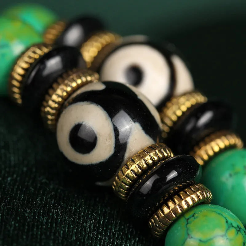 Natural turquoise beaded bracelet with 108 polished 8mm round beads on a wrist.