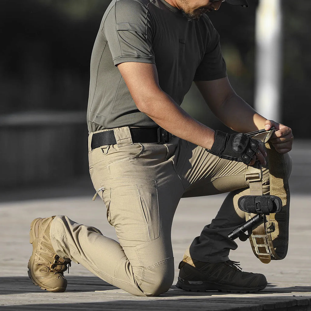 Men's loose cargo pants in cotton blend with multiple pockets, available in khaki, black and grey green.