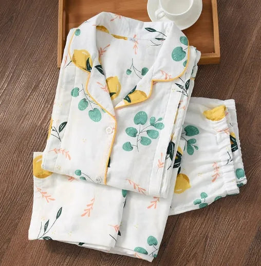 Traditional polyester maternity pajama set with turn-down collar, full bell sleeves, and ankle-length trousers in solid natural colour