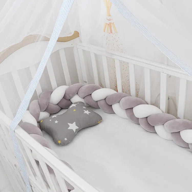 Baby crib bumper braid knot pillow cushion in spandex velvet fabric, shown in a multi-colour option.