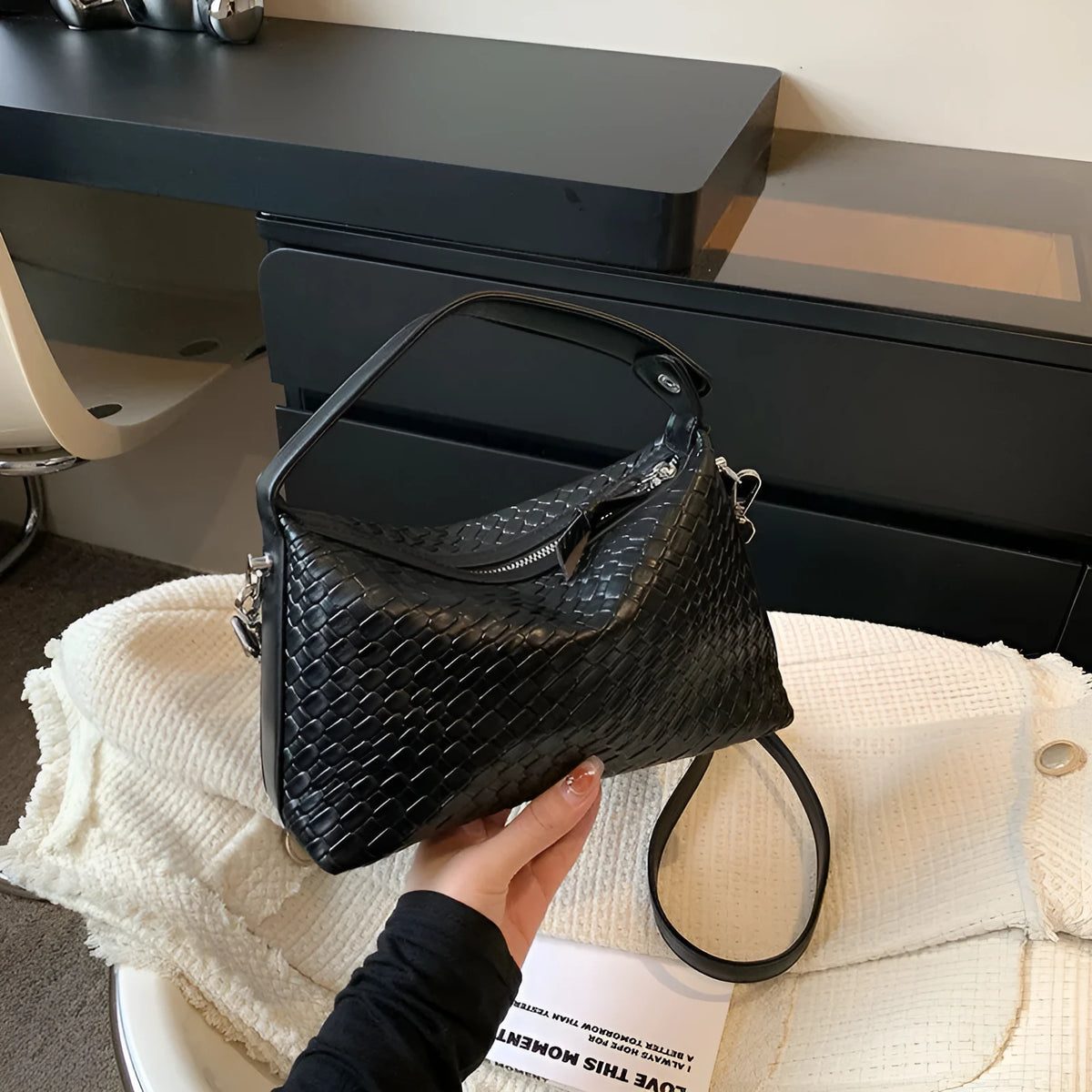 PU shoulder messenger bag in black with horizontal square shape, 23x15x8cm, single strap, sandwich pocket, and weaving details.