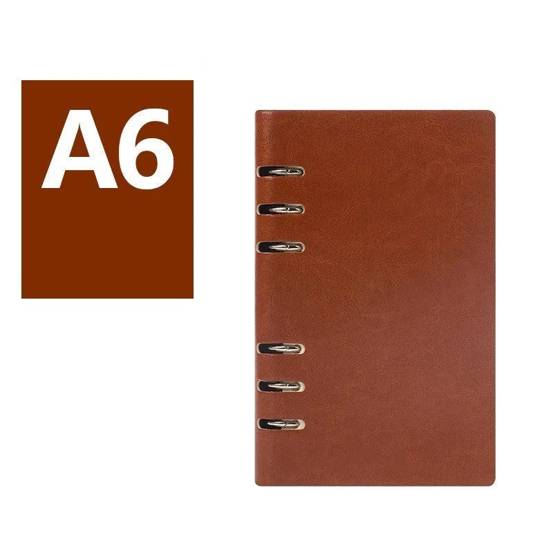 A5 loose-leaf business notebook with a black imitation leather cover, open to show beige paper.