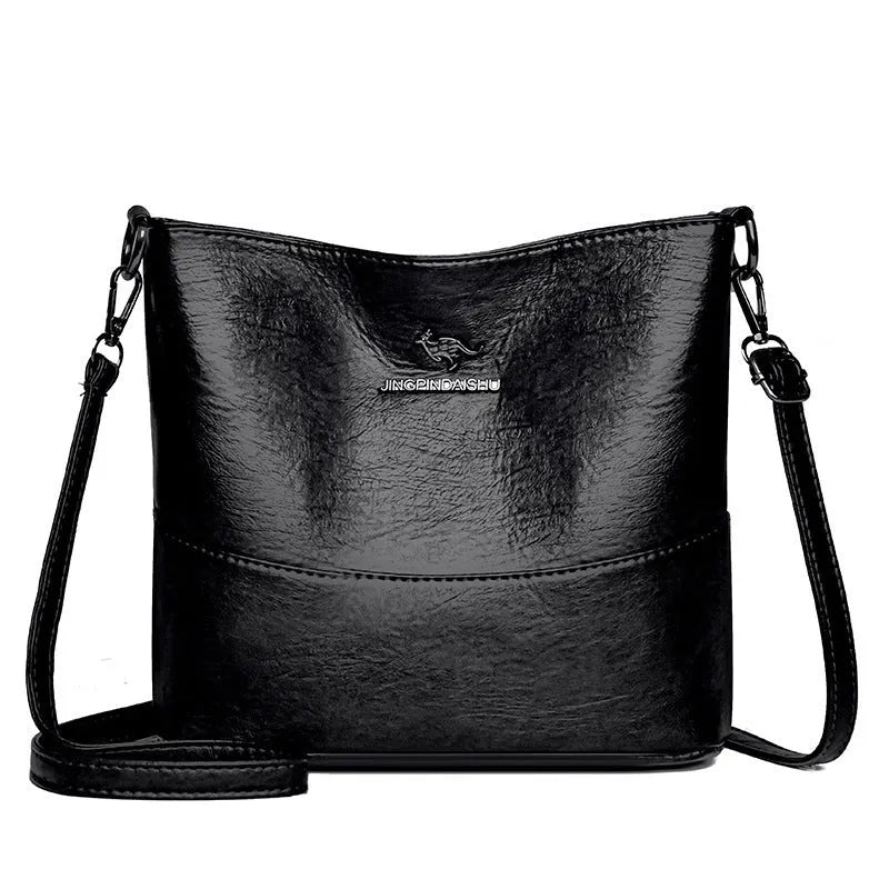 Women's casual soft leather bucket shoulder bag in black, wine red, or ginger yellow, showing large capacity and minimalist design.