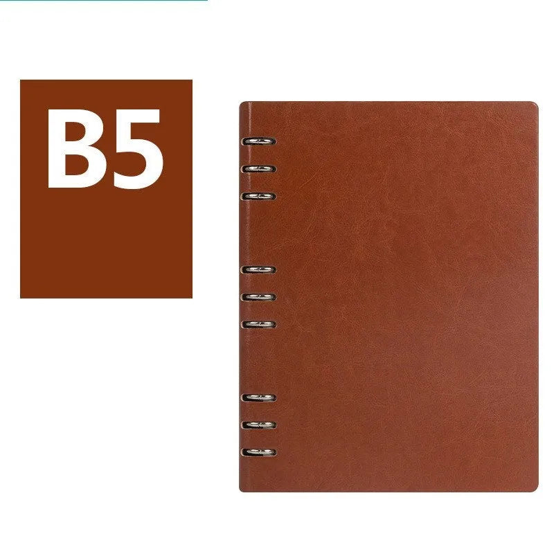 A5 loose-leaf business notebook with a black imitation leather cover, open to show beige paper.