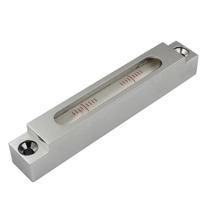 Metal and glass mini strip spirit level measuring 132mm long with accuracy markings.