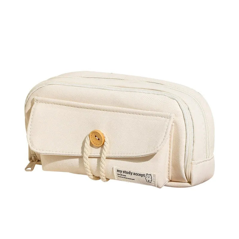 Girls canvas pencil case with button fastening showing large capacity for approximately 80 pens in beige colour