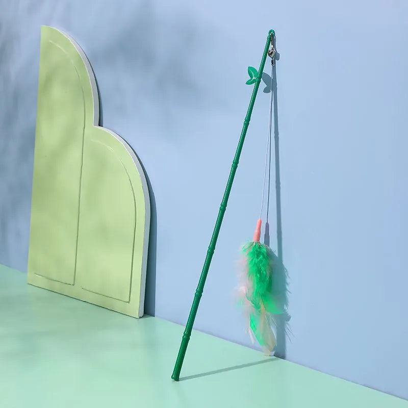 Green interactive cat feather wand toy with bell and feather attachments