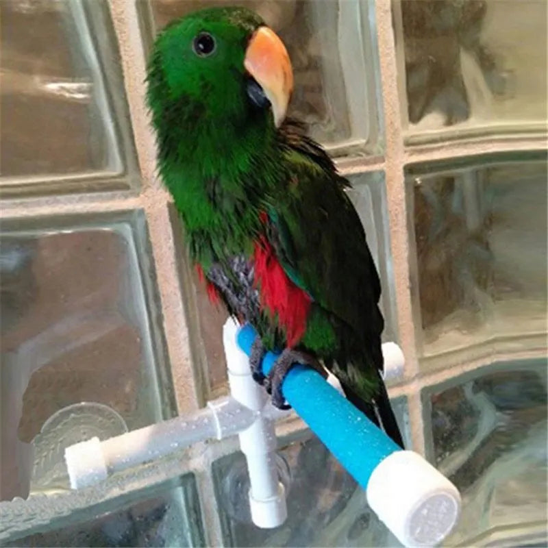 White plastic parrot bath shower stand with three suction cups folded flat on table showing 22x18x24cm dimensions