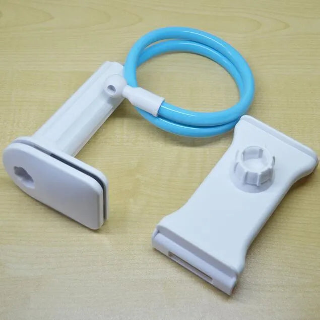 Black aluminium alloy and plastic bedside phone handset with long arm extended on a wooden table.