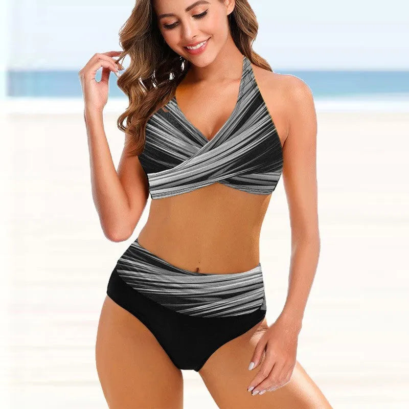 Ladies striped tie-dye hollow bikini set on a model, showing high-waisted briefs and backless design.