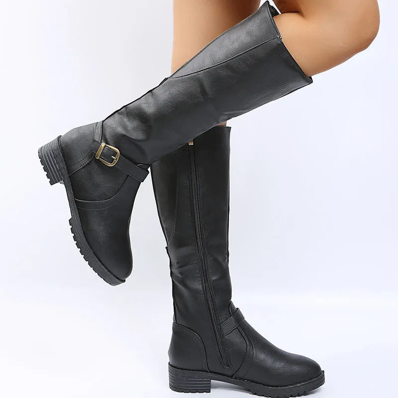 Yellow women's knight boots with a square heel, round toe, and buckle detail on a high calf shaft.