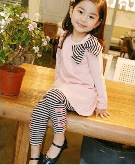 Girls pink cotton clothing set showing coordinated pieces available in four size options