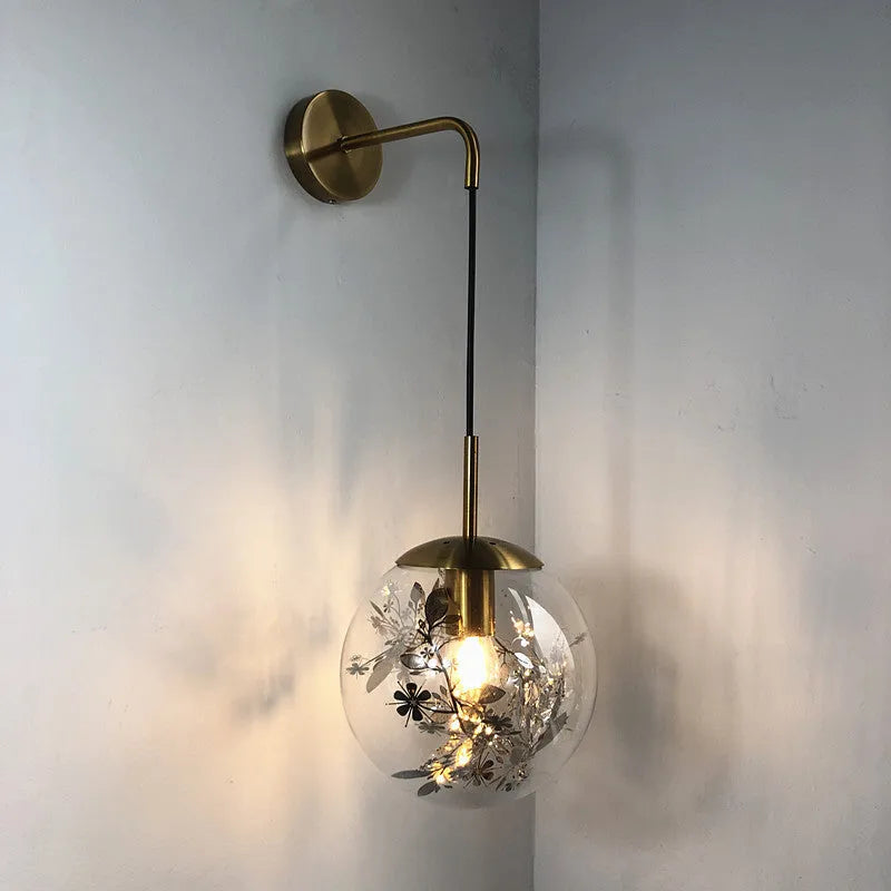 Modern glass wall-mounted bedside lamp in gold or silver finish, shown in 15cm and 20cm size options.