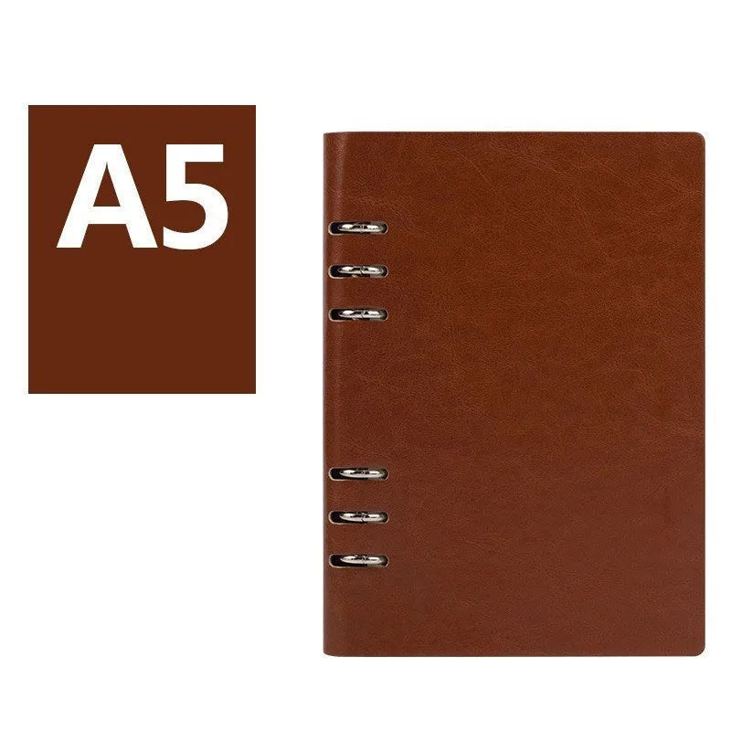 A5 loose-leaf business notebook with a black imitation leather cover, open to show beige paper.