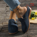 Women's casual wedge slipper in light brown with cloth upper and rubber sole.