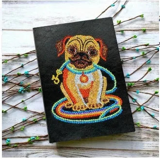 Black A5 DIY diamond painting notebook open showing pages for glitter artwork