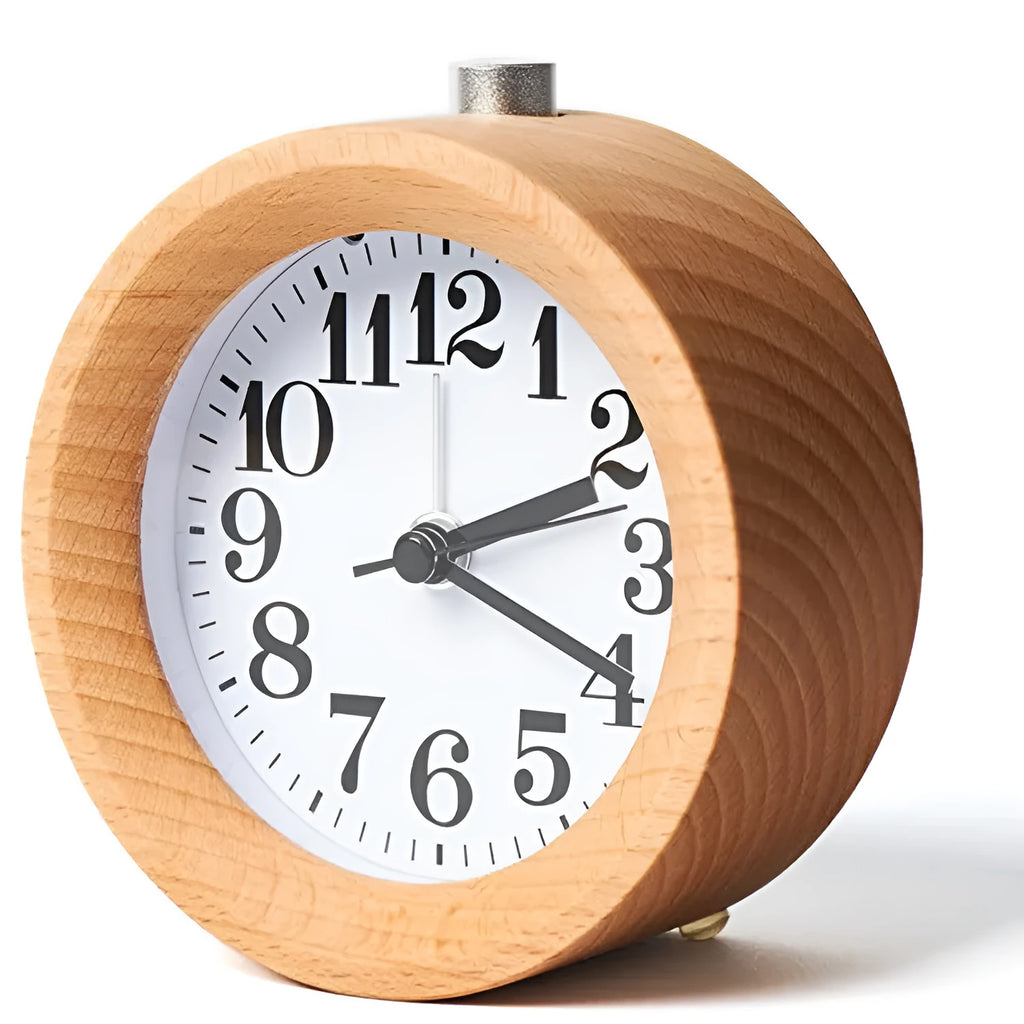 Solid beech wood analogue alarm clock with silent snooze on a wooden bedside table.