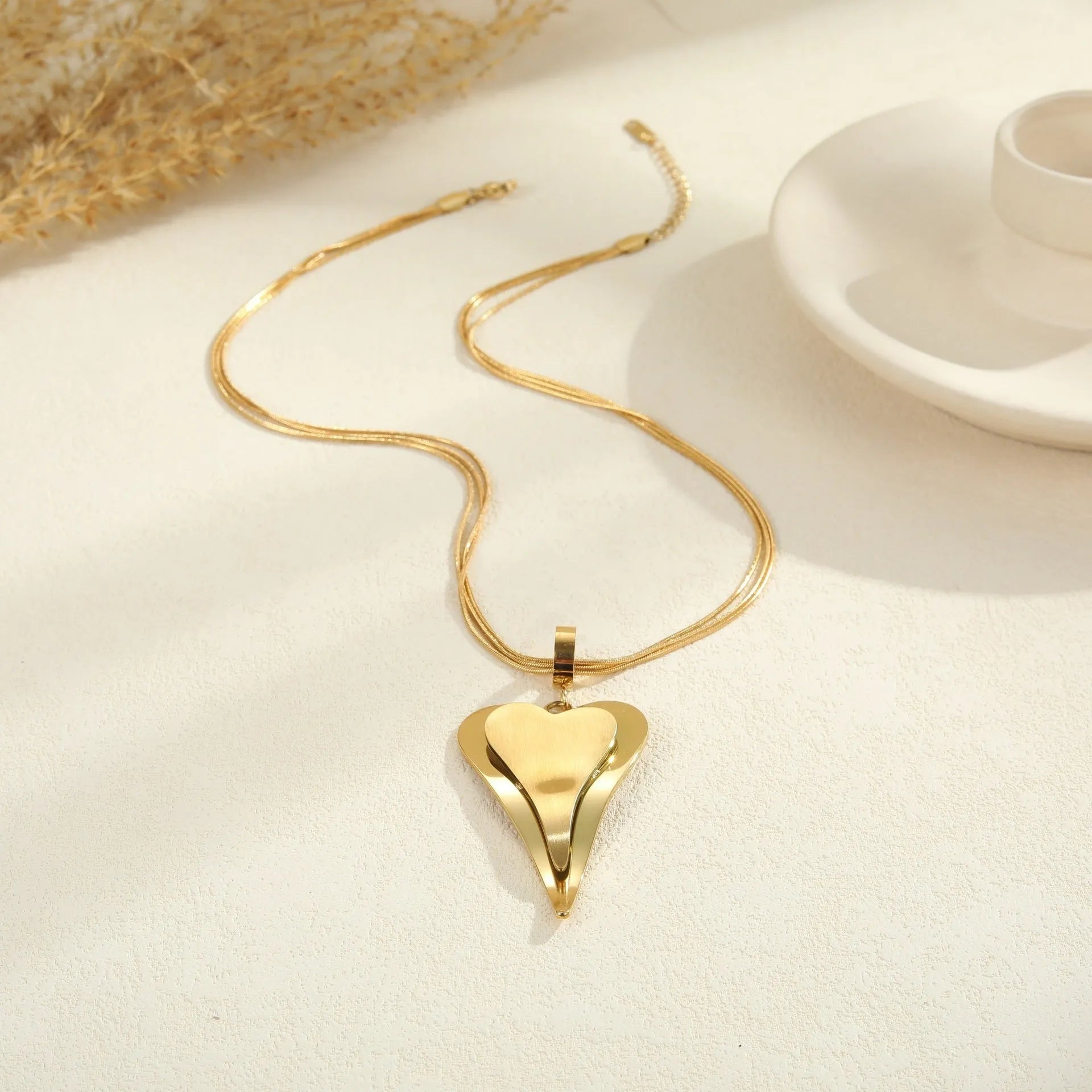 Geometric double heart pendant necklace with snake bones chain pattern in stainless steel