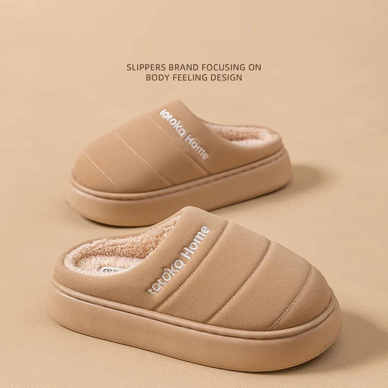 Pair of khaki fleece-lined cotton slippers with round toe and flat platform sole