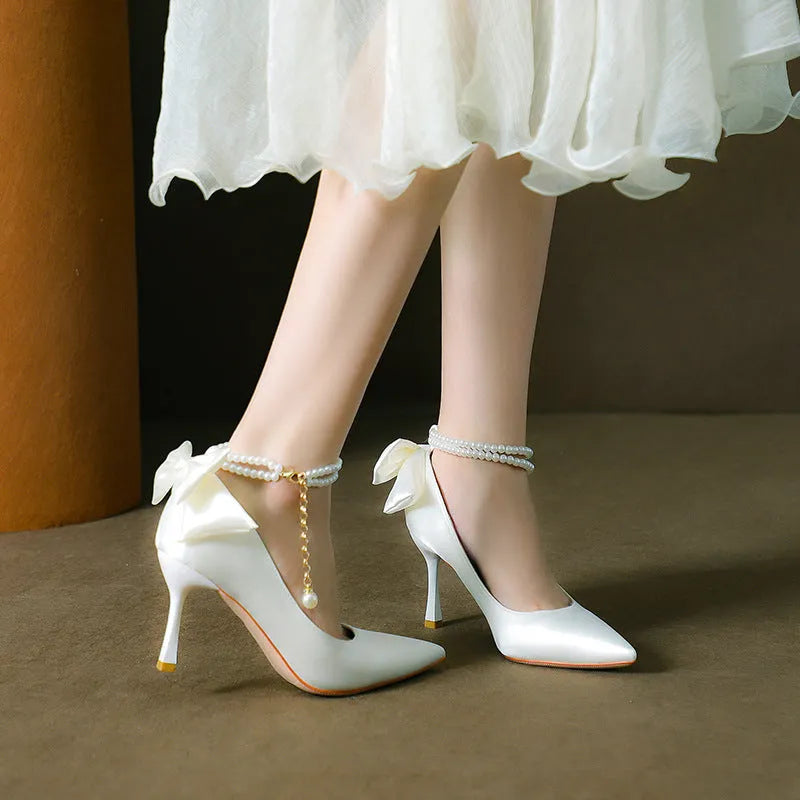 Stiletto pointed toe satin pumps with beaded pearl strap in Champagne colour