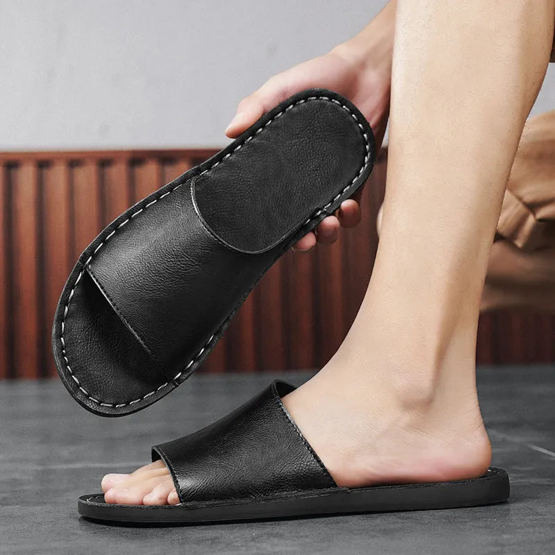 Brown men's leather sandal with rubber sole on a white background