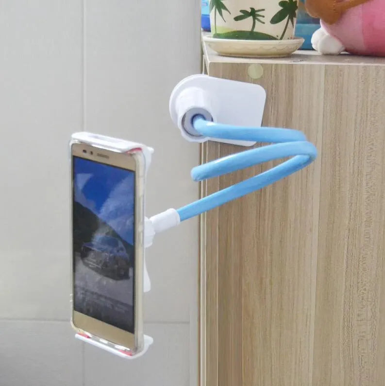 Black aluminium alloy and plastic bedside phone handset with long arm extended on a wooden table.
