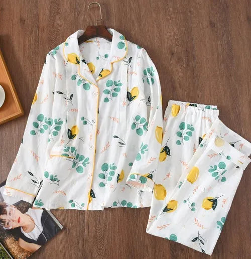 Traditional polyester maternity pajama set with turn-down collar, full bell sleeves, and ankle-length trousers in solid natural colour