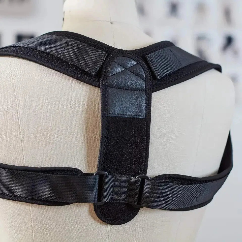 Black adjustable posture correction strap with breathable mesh construction