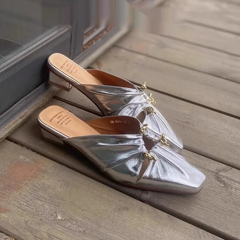 Women's gold genuine leather half toe cap slippers with low heel and square toe on a white background.