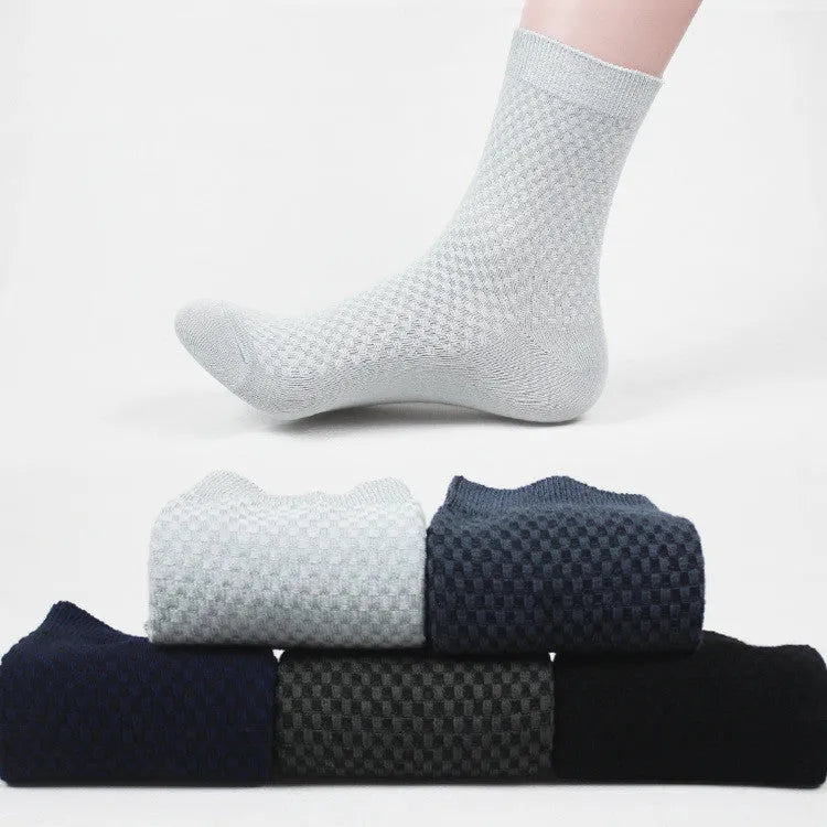 Men's bamboo fibre socks in a small square pattern, shown in neutral colours including grey and navy.