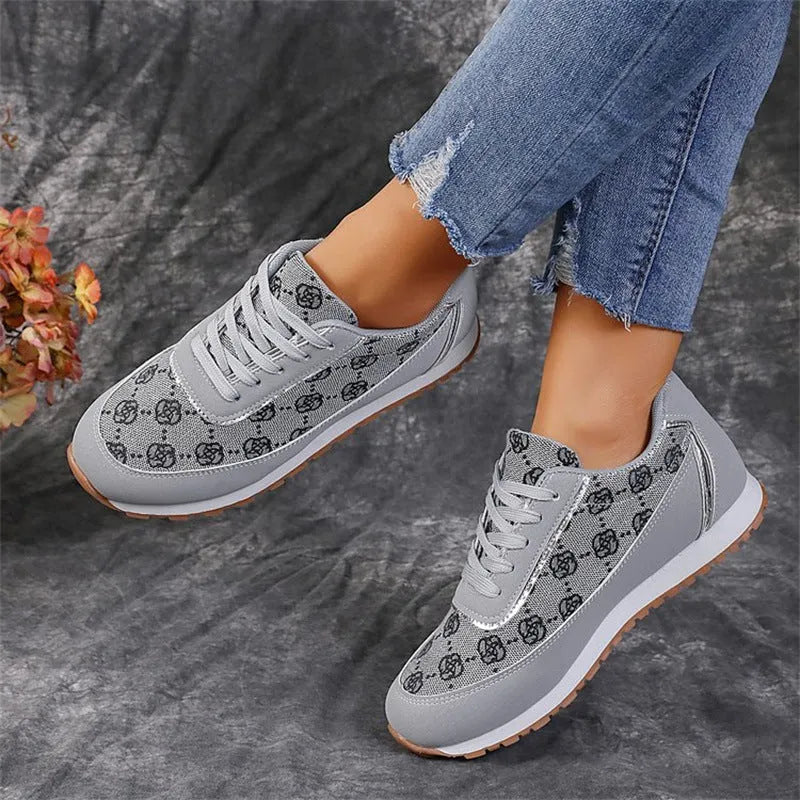 Flower print lace-up sneakers in camel with round toe and rubber sole
