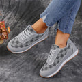 Flower print lace-up sneakers in camel with round toe and rubber sole