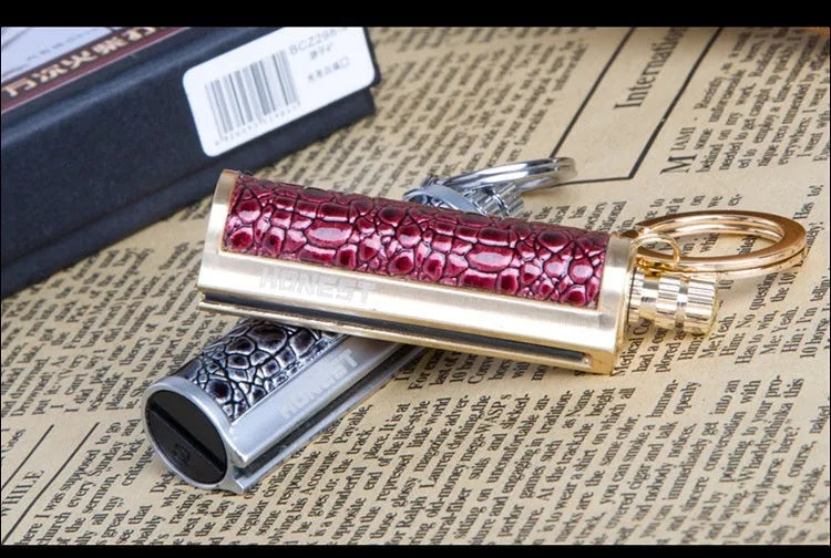 Windproof leather lighter with personality metal sticker in red, black, reddish-brown or yellow leather.